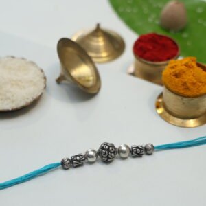 String of silver manis Rakhi